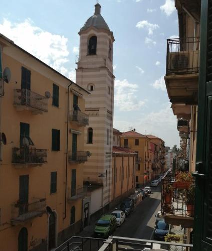 a view of a city street with a clock tower at Casa Minù in La Spezia