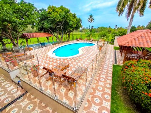 an overhead view of a swimming pool with chairs and trees at Senderos del Mar in Buritaca