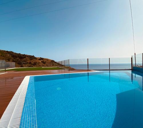 a swimming pool on the roof of a house at Villas Calhau da Lapa 51 in Campanário