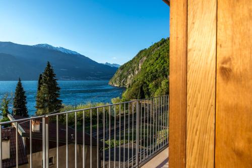 a balcony with a view of a lake and mountains at Residenza Luigina in Varenna