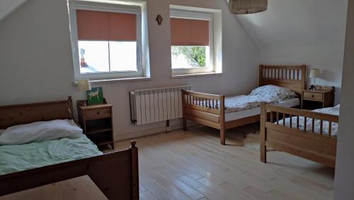 Postel nebo postele na pokoji v ubytování Wielgosówka