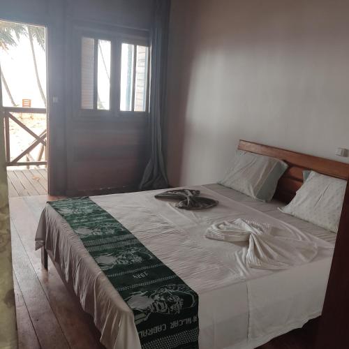 Ein Bett oder Betten in einem Zimmer der Unterkunft Domus Praia Jalé