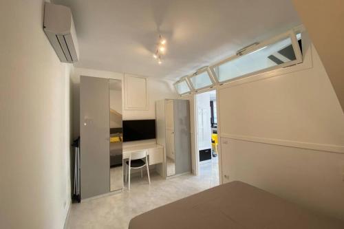Televízia a/alebo spoločenská miestnosť v ubytovaní I Limoni Capri Apartment