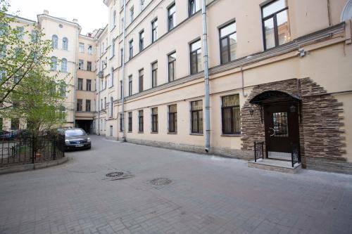 an empty street with a car parked next to a building at Mini Hotel na Nevskom 136 in Saint Petersburg