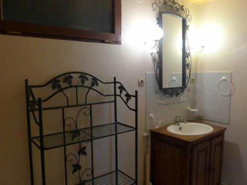 a bathroom with a sink and a mirror at Gîte Cusey, 3 pièces, 4 personnes - FR-1-611-5 in Cusey