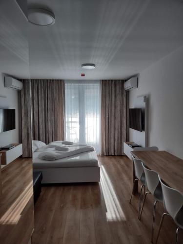 Cama o camas de una habitación en Apartman Kyjev