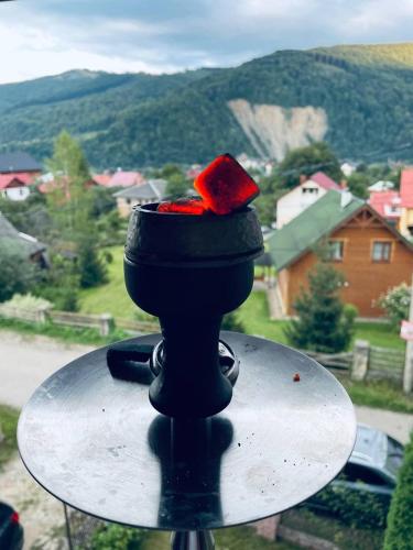 a table with a red ribbon on top of it at Svitlyachok in Yaremche