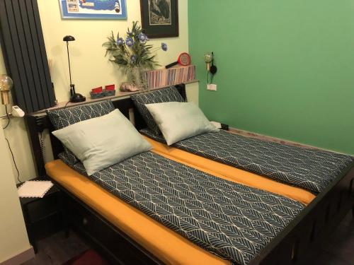 a couple of beds in a room at Centrum Meppel in Meppel