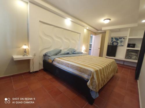 En eller flere senge i et værelse på Sosua Suites Condos