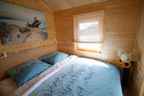 Krevet ili kreveti u jedinici u objektu Domki pod Łebą