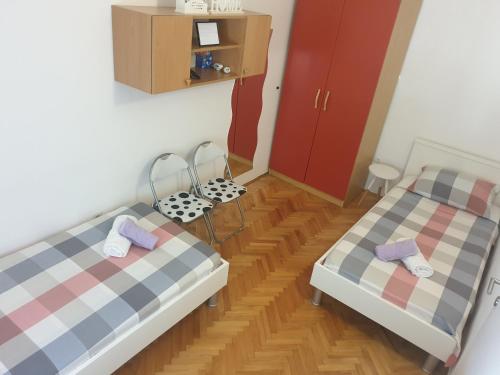 Łóżko lub łóżka w pokoju w obiekcie Apartment Nina
