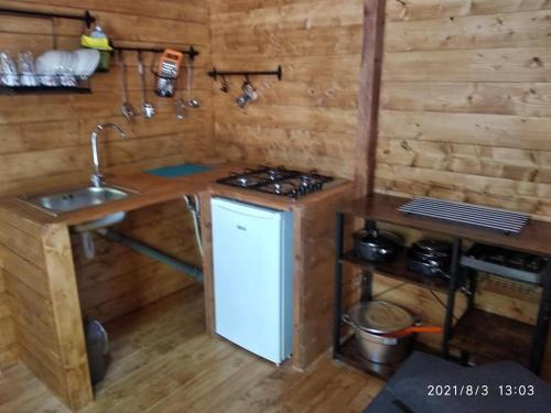 a small kitchen with a sink and a stove at Camping Borghetti in Ortona