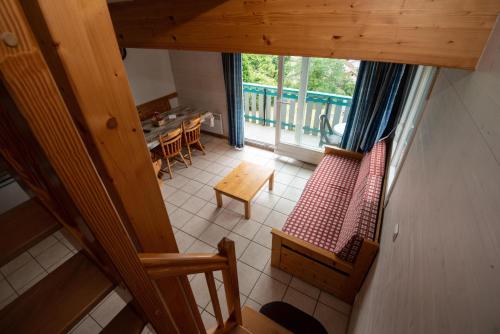 an overhead view of a living room with chairs and a table at Les Adrets in Gérardmer