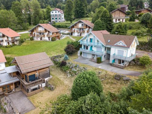 an aerial view of a village with houses at Les Adrets in Gérardmer