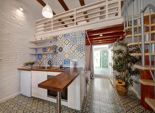 a kitchen with a sink and a counter top at Flamenco Beach Loft in Valencia
