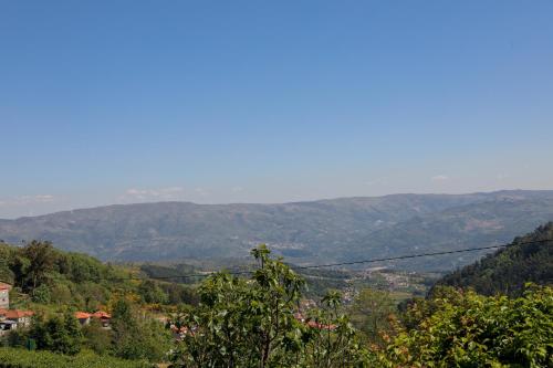 a view of a valley with mountains in the distance at Casa das Lages in Viariz
