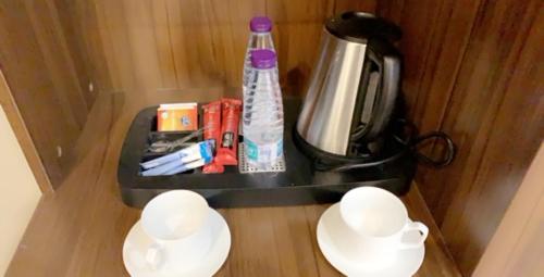 Tetera y cafetera en برج الأعمال