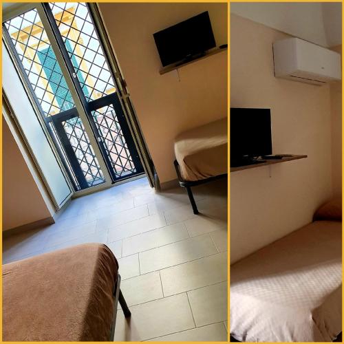 a room with two beds and a window at SPARTA in Ercolano
