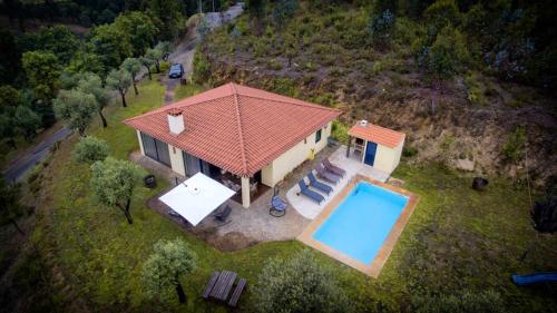 an aerial view of a house with a swimming pool at Boavista Country Houses no 87 in Cabeceiras de Basto