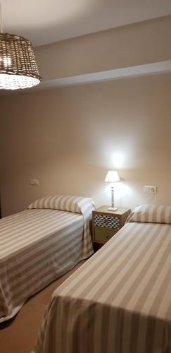 מיטה או מיטות בחדר ב-CASA GRAN MONSONIS