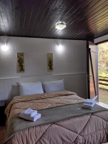 Katil atau katil-katil dalam bilik di Villa de charme suítes