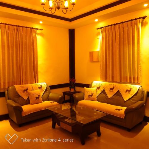 a living room with two couches and a coffee table at 星月澄嵐 in Yuchi