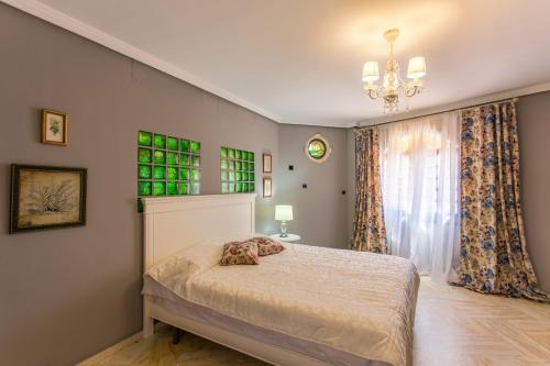Ένα ή περισσότερα κρεβάτια σε δωμάτιο στο Apartamentos Gaudi Style