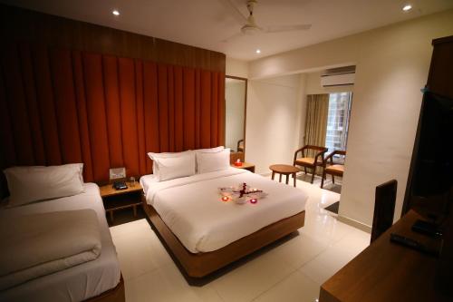 En eller flere senge i et værelse på Hotel Dream Residency