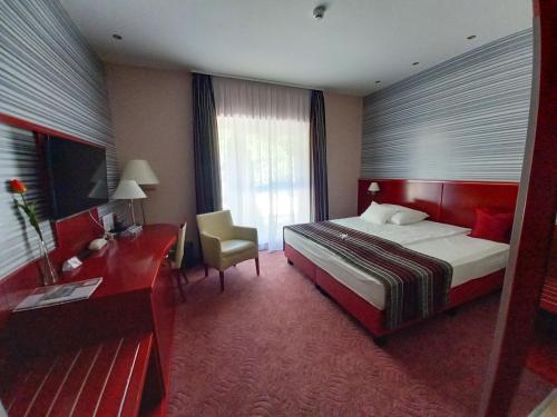 Postel nebo postele na pokoji v ubytování Veronika Hotel