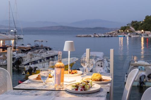 
a table that has some food on it at Melina Bay Boutique Hotel in Kassiopi
