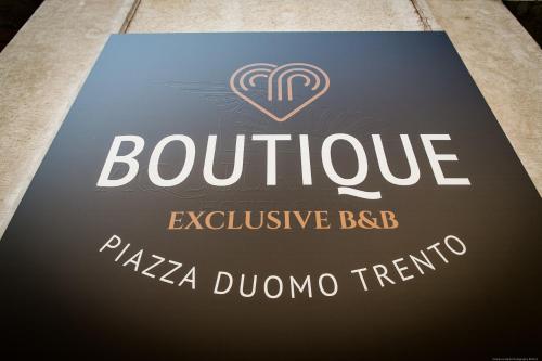 a sign for a boutique exclusive bbq and pizzacanoieri at Boutique Exclusive B&B in Trento