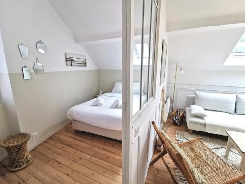 Tempat tidur dalam kamar di Le repaire du Cap-hornier