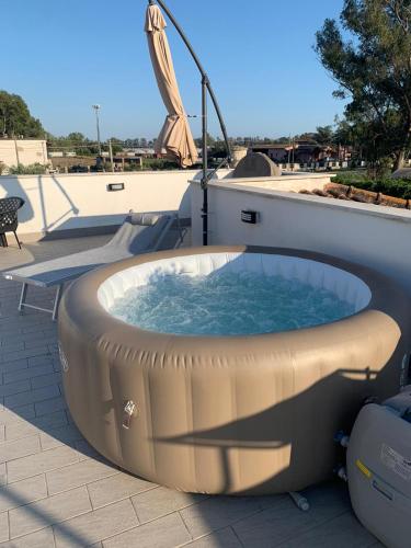 a hot tub on the side of a building at Gioema in Borgo Vodice