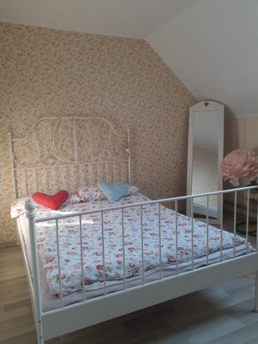 a bedroom with a white bed with a mirror at Homestay Khomenko in Perechin