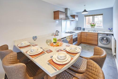 a kitchen with a table with chairs and a dining room at Host & Stay - Vermont in Marske-by-the-Sea