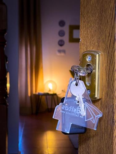 a bunch of keys hanging from a door knob at Las Casitas de Santillana in Santillana del Mar