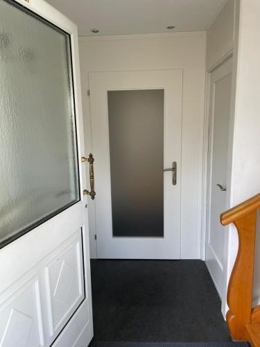 a door leading into a hallway with a mirror at Bregenzer Traum am Bodensee inkl Fahrräder in Bregenz