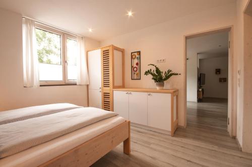 a bedroom with a bed and a window at Hochsitz Schladming in Schladming