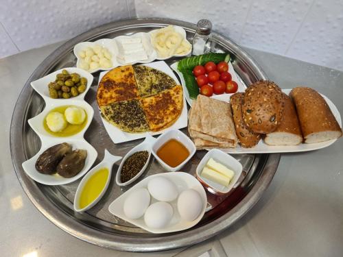 a tray of food with eggs and other foods on it at סוויטת נור Noor Suite in Majdal Shams