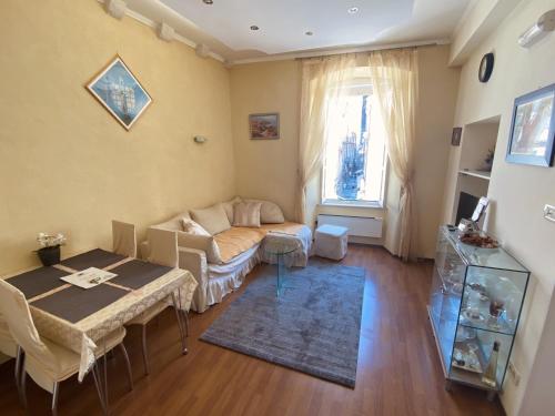 a living room with a couch and a table at Apartment Tomasović Old Town in Dubrovnik