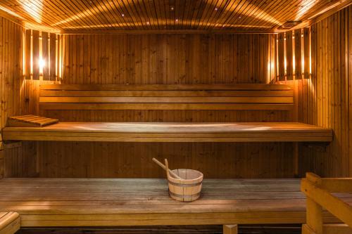 
a room with a wooden floor and wooden walls at Chalet RoyAlp Hôtel & Spa in Villars-sur-Ollon
