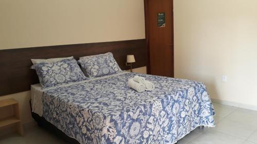 Postel nebo postele na pokoji v ubytování Pousada Pedra do Sossego