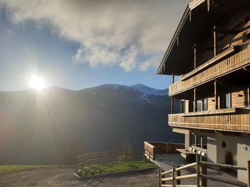 a view of the sun shining on a mountain at Nesterhof in Aschau