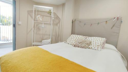 Llit o llits en una habitació de Ático Plaza España