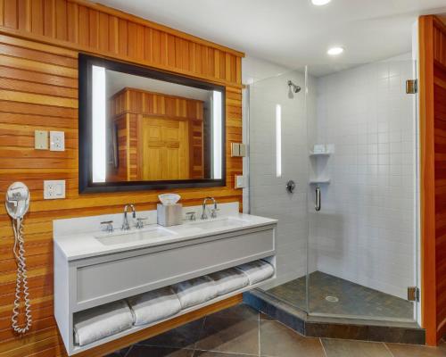 a bathroom with a sink and a mirror at Mill Falls Resort Collection at the Lake in Meredith