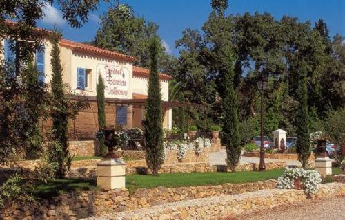 a building with a sign in front of it at La Bastide de Valbonne in Valbonne