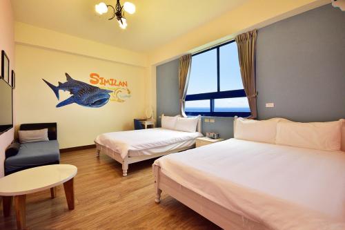 Katil atau katil-katil dalam bilik di Qing Feng Diving B&B