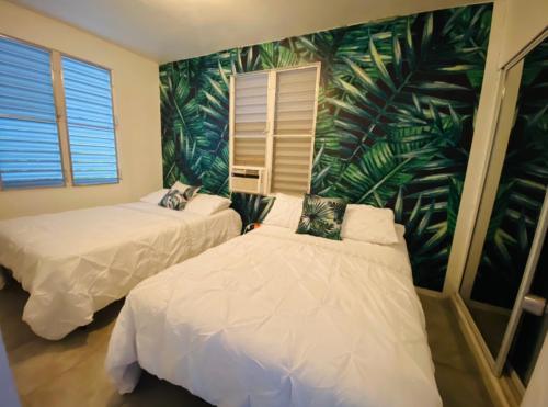 A bed or beds in a room at Tropical Getaway
