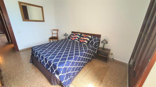 Ένα ή περισσότερα κρεβάτια σε δωμάτιο στο Apartamento en primera linea en la Playa de San Juan