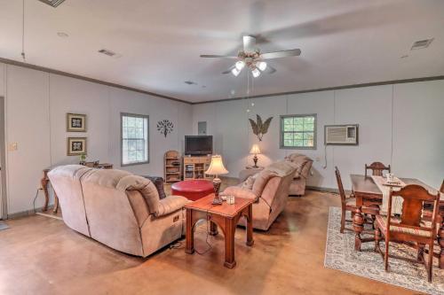 a living room with two couches and a table at Heavenly Heber Springs Hideaway Fish and Hike! in Heber Springs